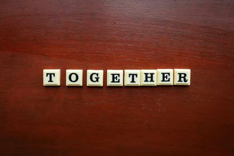Warm, dignified portrait — elders together, hopeful not pitying